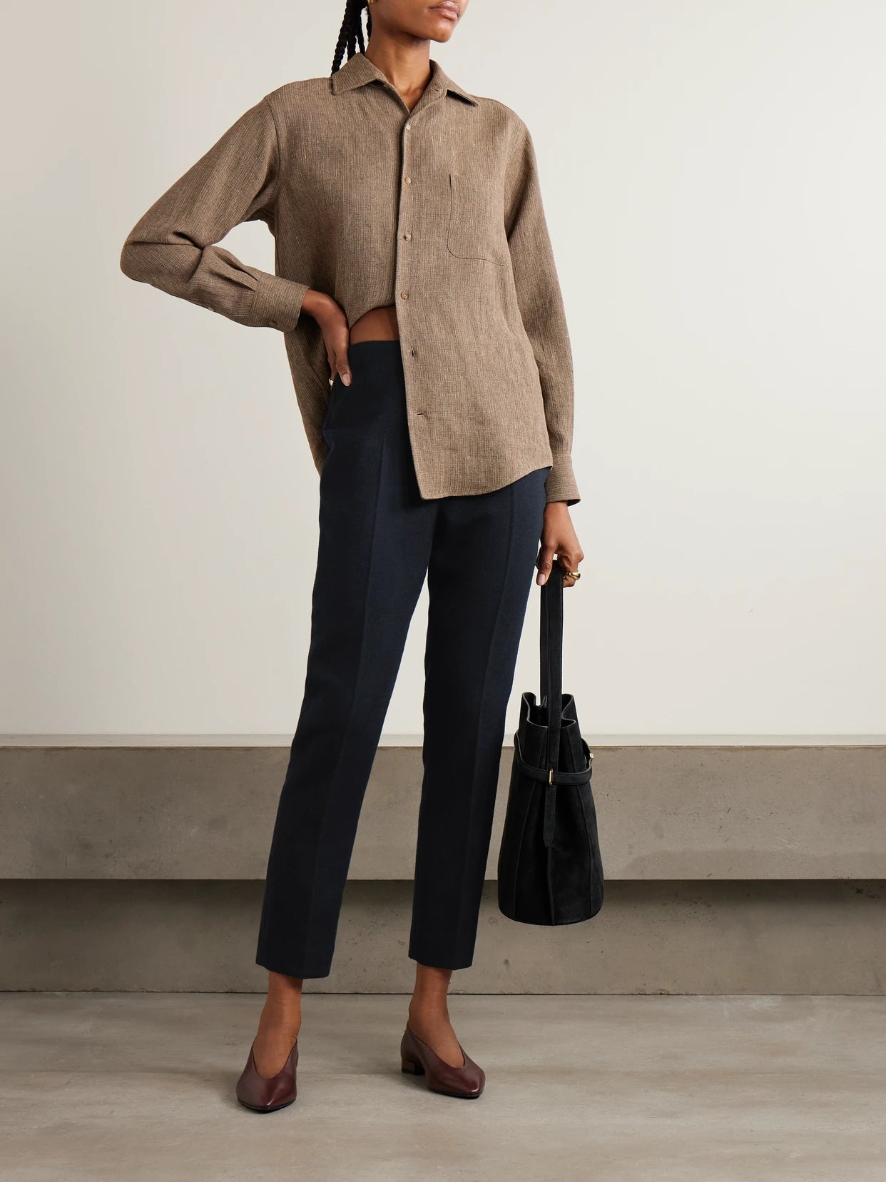 Image of a model wearing Pants. Product name - Ralph Pleated Cashmere Straight-leg Pants in Navy colour by brand - Loro Piana