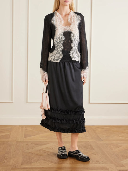 Image of a model wearing Tops. Product name - Lace-trimmed Jersey Cami in Black colour by brand - Anna Sui