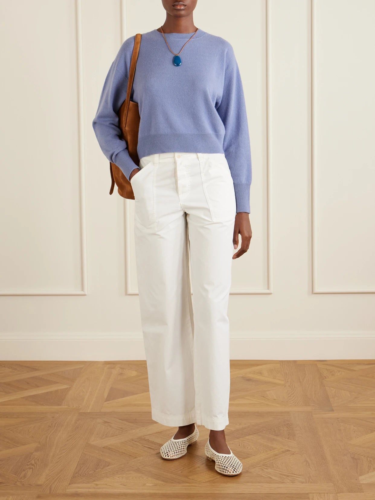 Image of a model wearing Outerwear. Product name - Menorca Cropped Cashmere Sweater in Blue colour by brand - Le Kasha