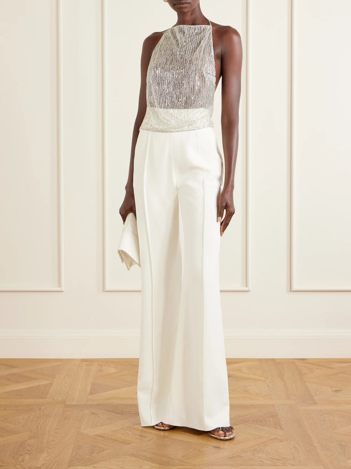 Image of a model wearing Tops. Product name - Rayy Sequined Mesh Top in Silver colour by brand - Ilkyaz Ozel