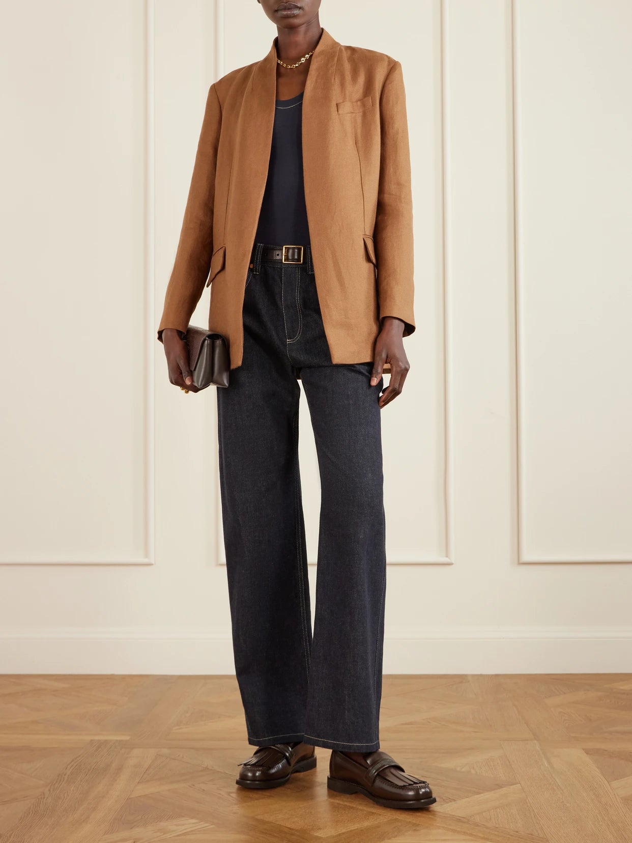 Image of a model wearing Tops. Product name - Bead-embellished Ribbed Cotton-blend Jersey Tank in Navy colour by brand - Brunello Cucinelli