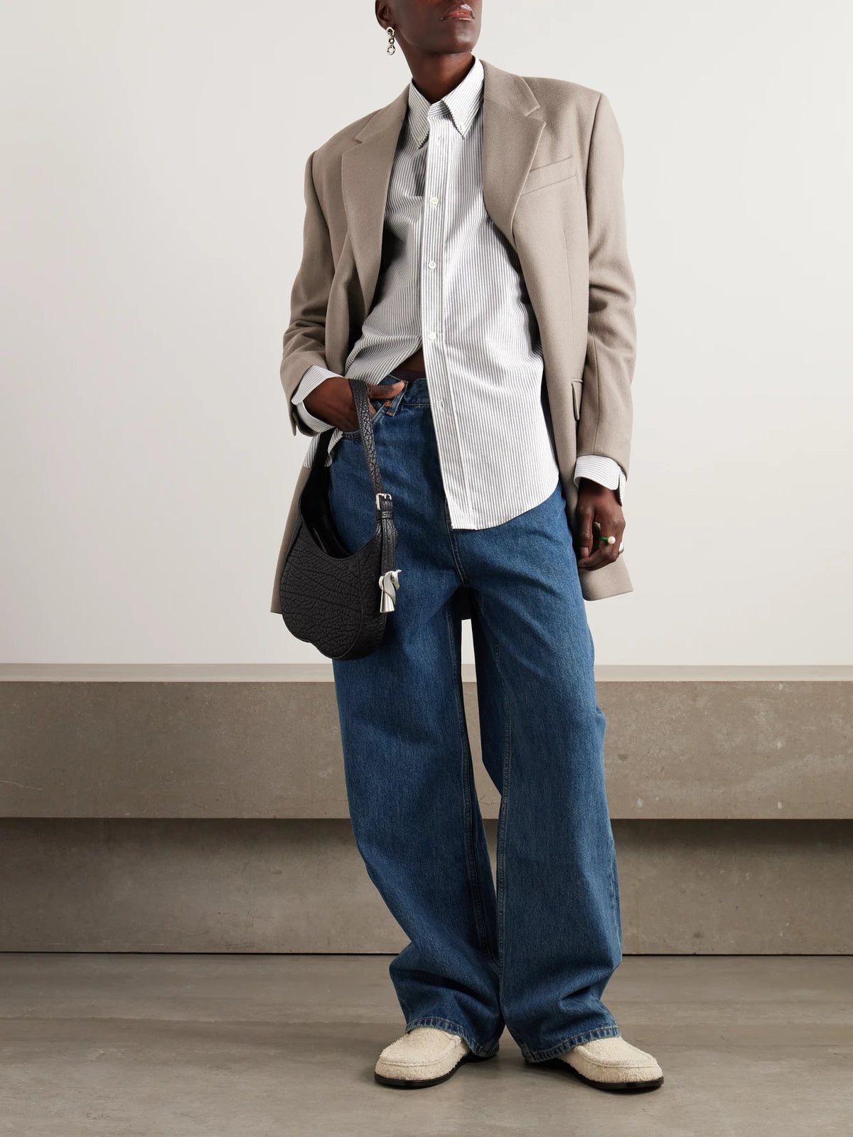 Image of a model wearing Tops. Product name - Adc Embroidered Striped Cotton-poplin Shirt in White colour by brand - AMI PARIS