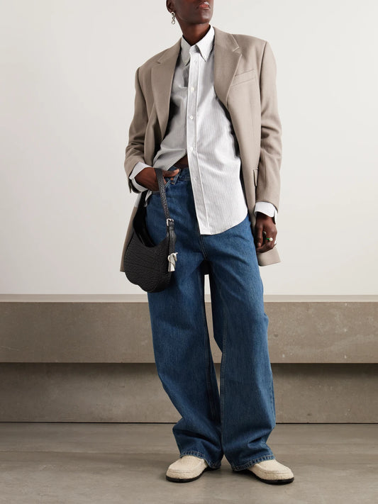 Image of a model wearing Tops. Product name - Adc Embroidered Striped Cotton-poplin Shirt in White colour by brand - AMI PARIS