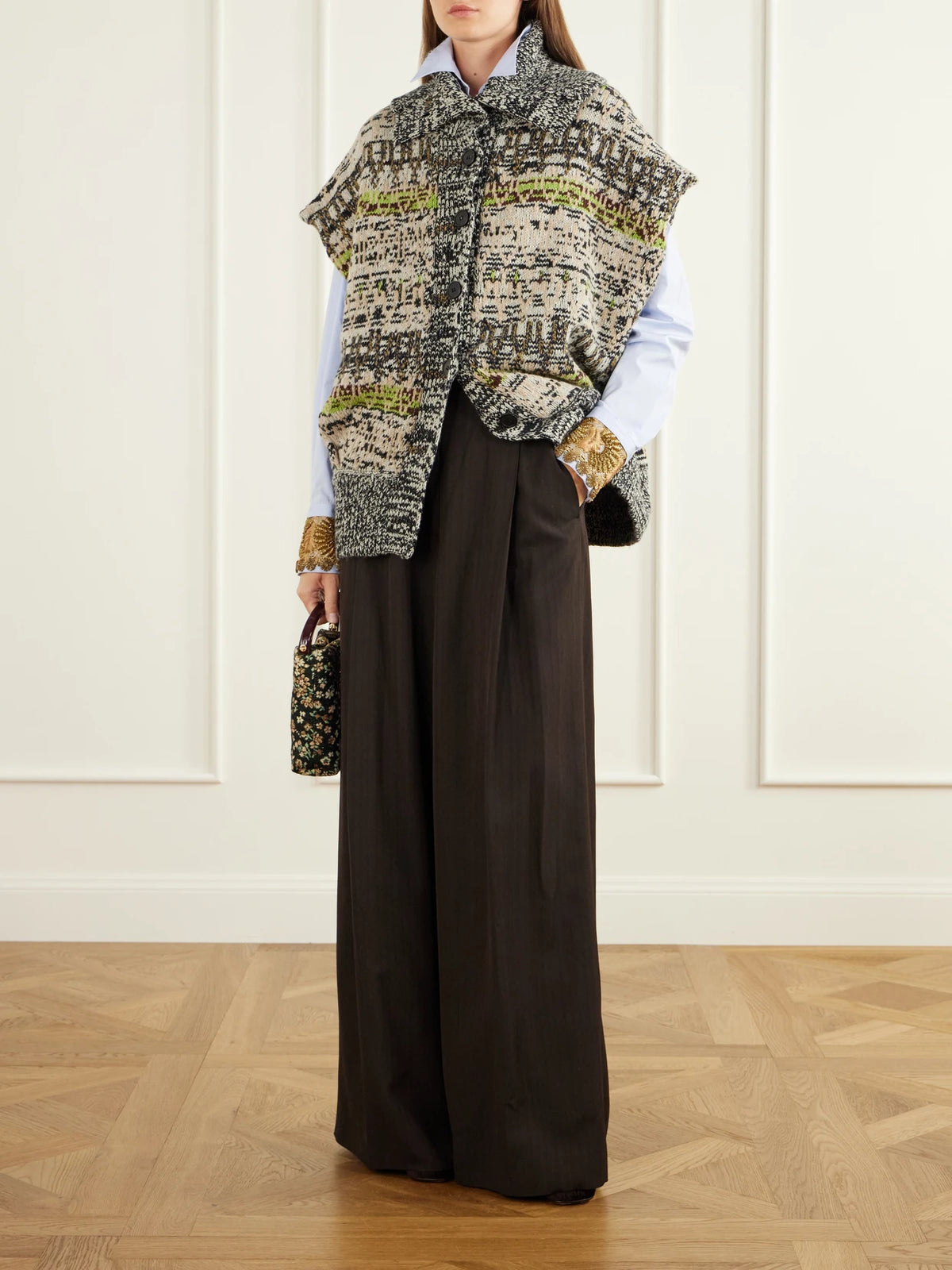 Image of a model wearing Outerwear. Product name - Sleeveless Intarsia-knit Wool And Cashmere-blend Vest in Multi colour by brand - Dries Van Noten