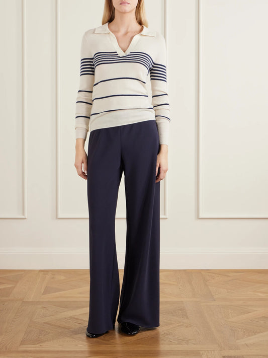 Image of a model wearing Outerwear. Product name - Lucille Striped Cashmere Polo Sweater in Ivory colour by brand - Nili Lotan