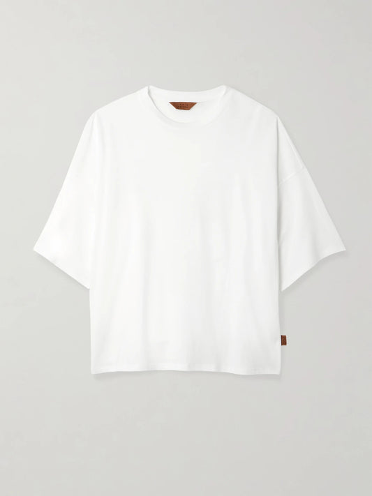 Image of a model wearing Tops. Product name - The Draped Tee Cotton And Modal-blend Jersey T-shirt in White colour by brand - Jamie Haller