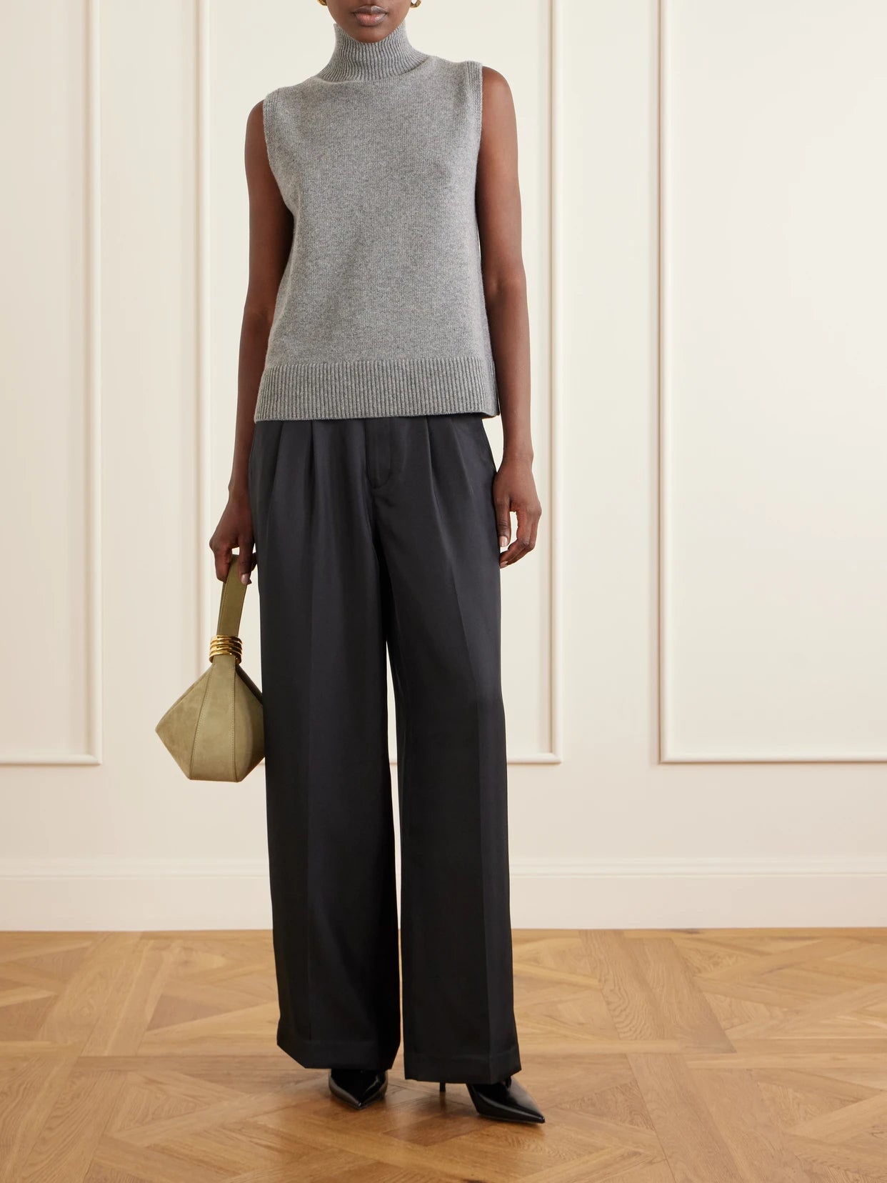 Image of a model wearing Outerwear. Product name - The Bruno Wool And Cashmere-blend Turtleneck Tank in Gray colour by brand - Brandon Maxwell
