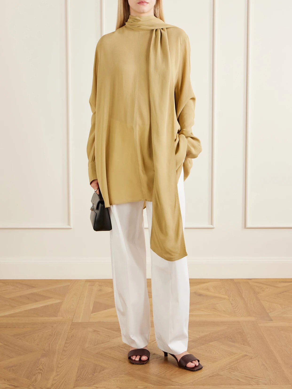 Image of a model wearing Tops. Product name - Tie-detailed Crepe Shirt in Tan colour by brand - TOTEME
