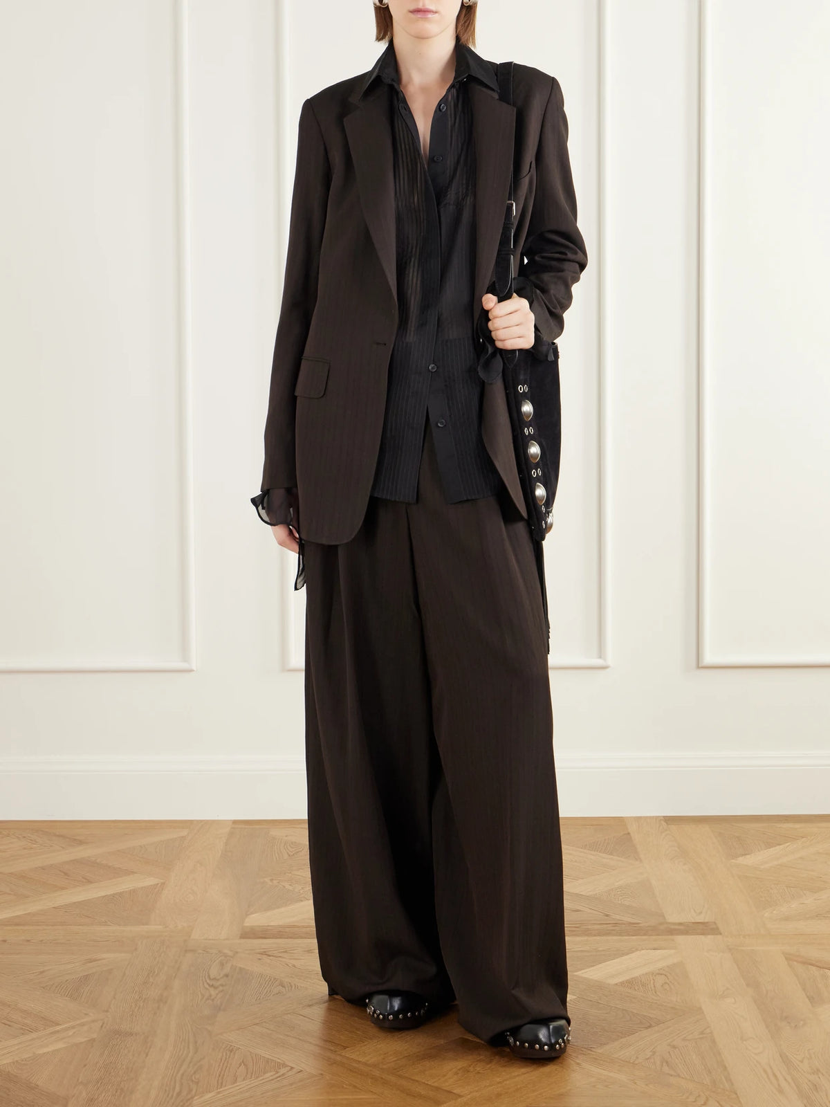 Image of a model wearing Tops. Product name - Pintucked Silk-chiffon Shirt in Black colour by brand - Etro