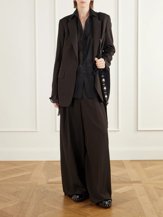 Image of a model wearing Tops. Product name - Pintucked Silk-chiffon Shirt in Black colour by brand - Etro