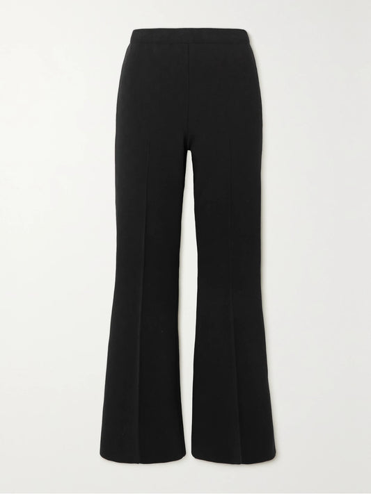 Image of a model wearing Pants. Product name - Kick Cropped Stretch-cotton Flared Pants in Black colour by brand - HIGH SPORT