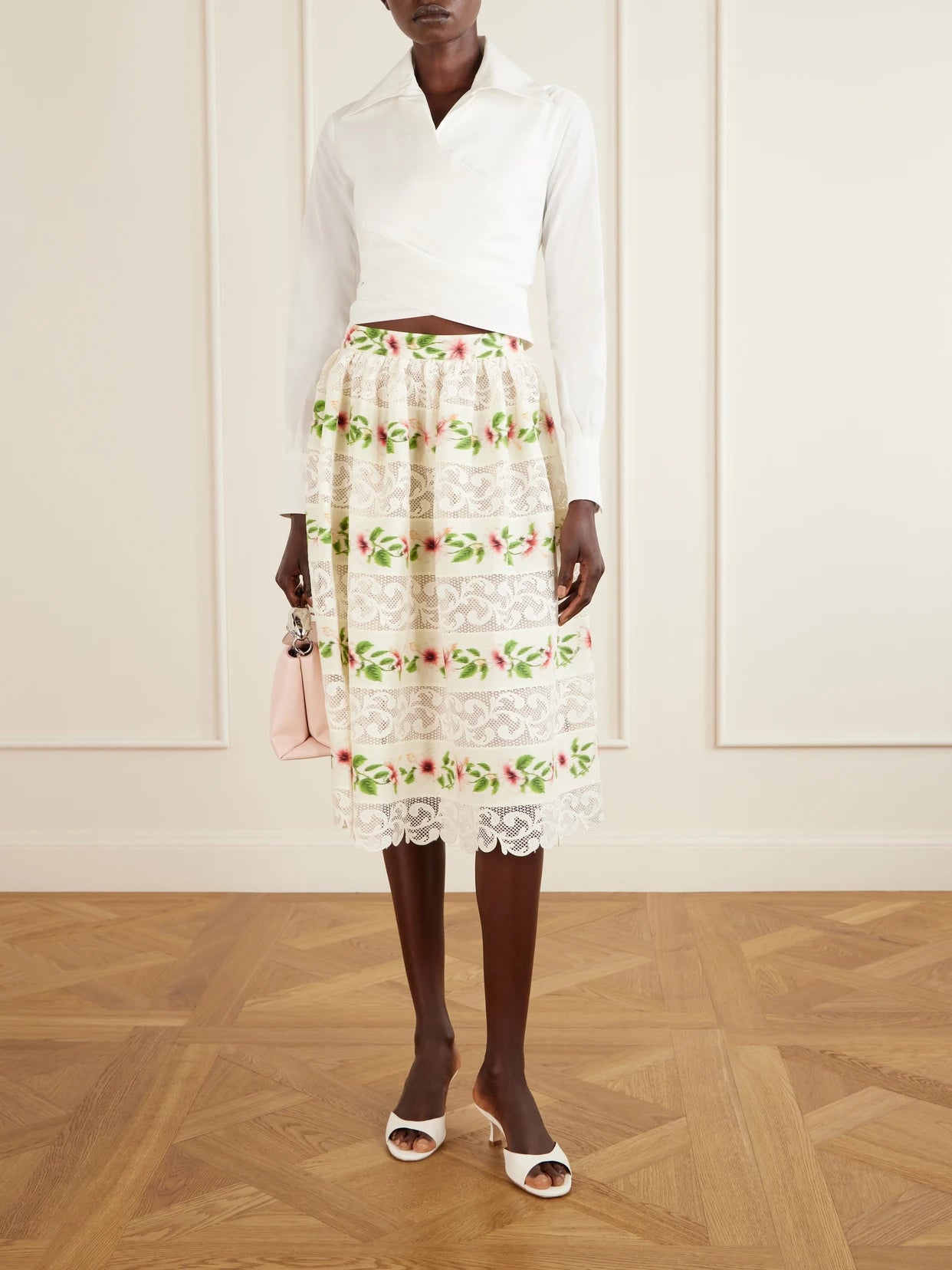 Image of a model wearing Skirts. Product name - Floral-print Lace-trimmed Cotton-blend Midi Skirt in White colour by brand - Oscar de la Renta