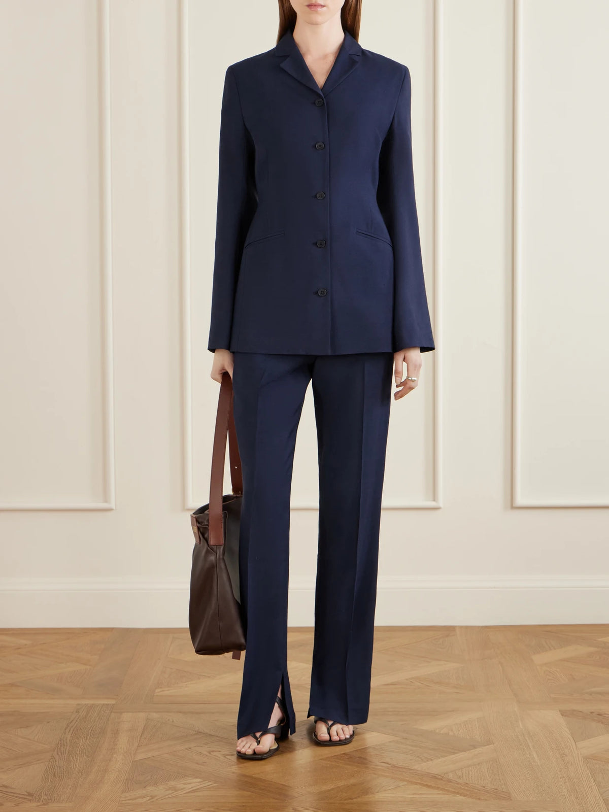 Image of a model wearing Pants. Product name - Charlie Woven Mid-rise Straight-leg Pants in Navy colour by brand - KALLMEYER