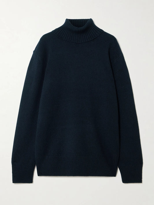 Image of a model wearing Outerwear. Product name - Cashmere Turtleneck Sweater in Navy colour by brand - TOTEME