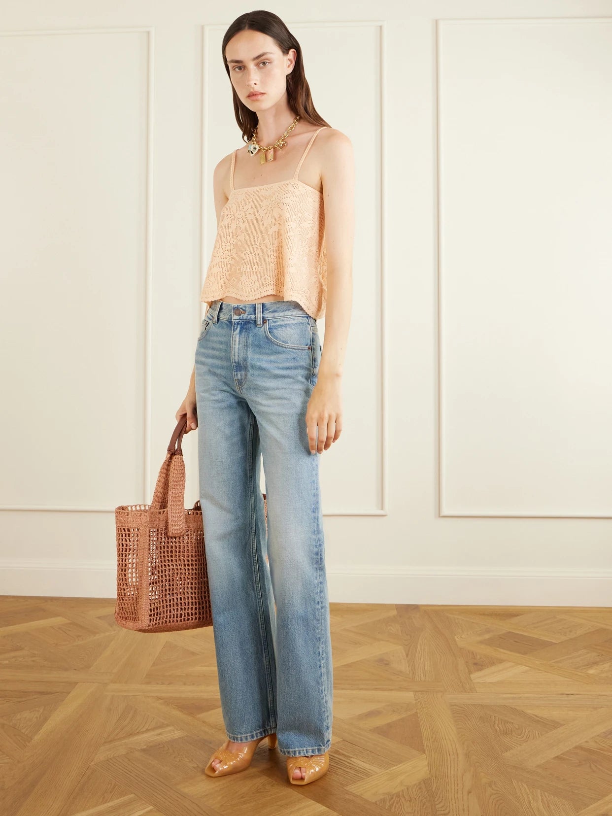 Image of a model wearing Tops. Product name - Crocheted Cotton Top in Pastel orange colour by brand - Chloé