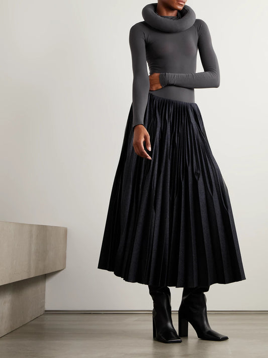 Image of a model wearing Skirts. Product name - Pleated Wool Midi Skirt in Dark gray colour by brand - Alaïa