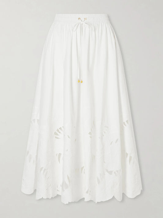 Image of a model wearing Skirts. Product name - Mahon Embroidered Cotton Midi Skirt in Ivory colour by brand - Zimmermann