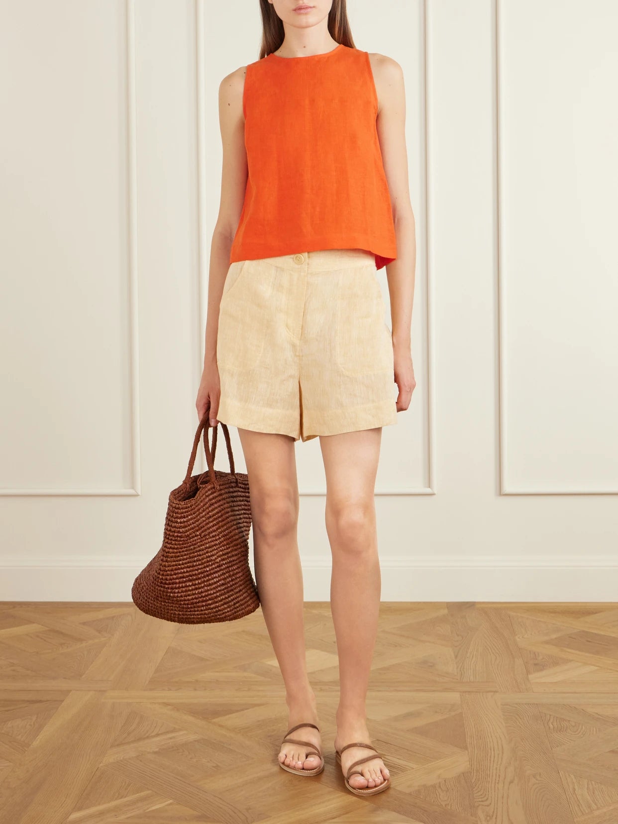 Image of a model wearing Tops. Product name - Ravie Linen Tank in Orange colour by brand - Eres
