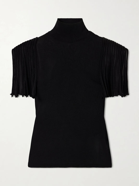 Image of a model wearing Tops. Product name - Cropped Jersey Top in Black colour by brand - Alaïa
