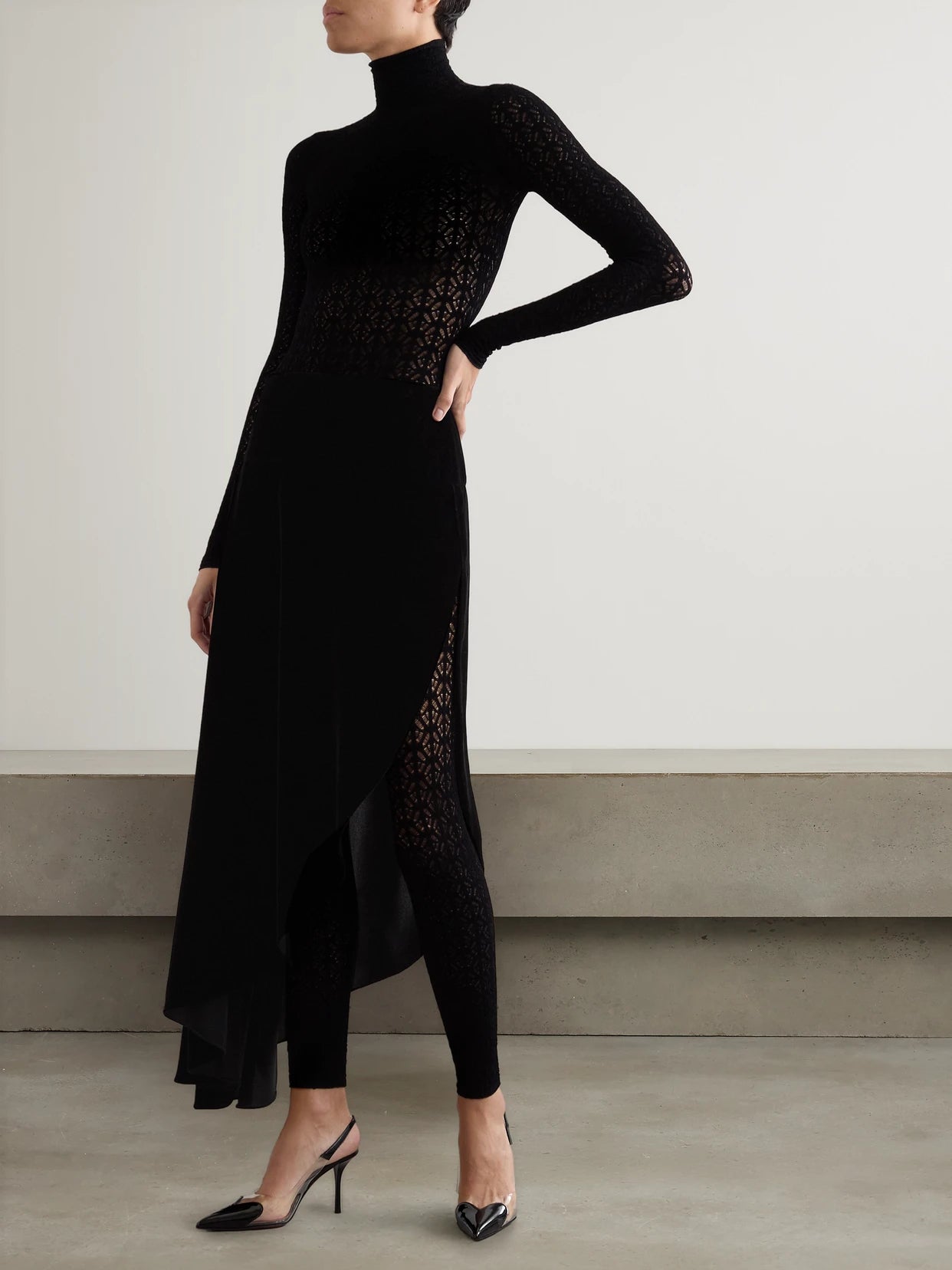 Image of a model wearing Skirts. Product name - Asymmetric Velvet Skirt in Black colour by brand - Alaïa