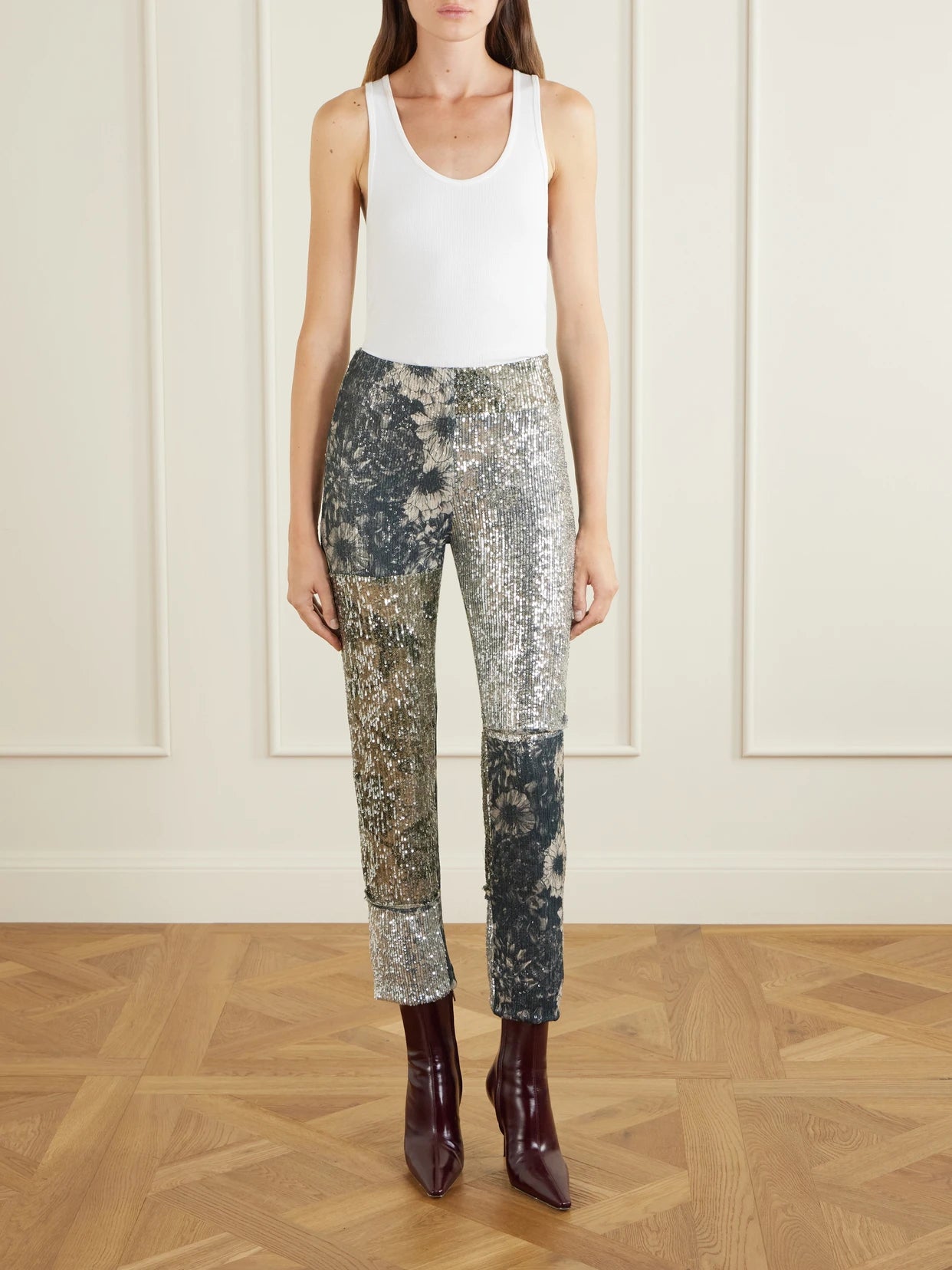 Image of a model wearing Pants. Product name - Sequined Patchwork Jersey Straight-leg Pants in Silver colour by brand - Maison Margiela
