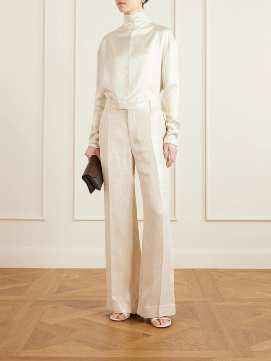 Image of a model wearing Pants. Product name - Metallic Linen Wide-leg Pants in White colour by brand - Brunello Cucinelli