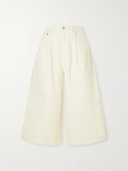 Image of a model wearing Shorts. Product name - 80's Gaucho Organic Cotton Shorts in Cream colour by brand - AGOLDE
