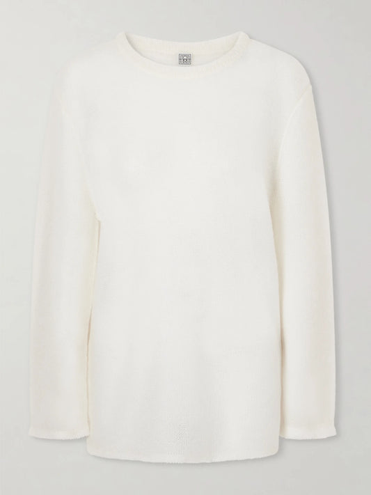 Image of a model wearing Outerwear. Product name - Mohair-blend Sweater in Off-white colour by brand - TOTEME