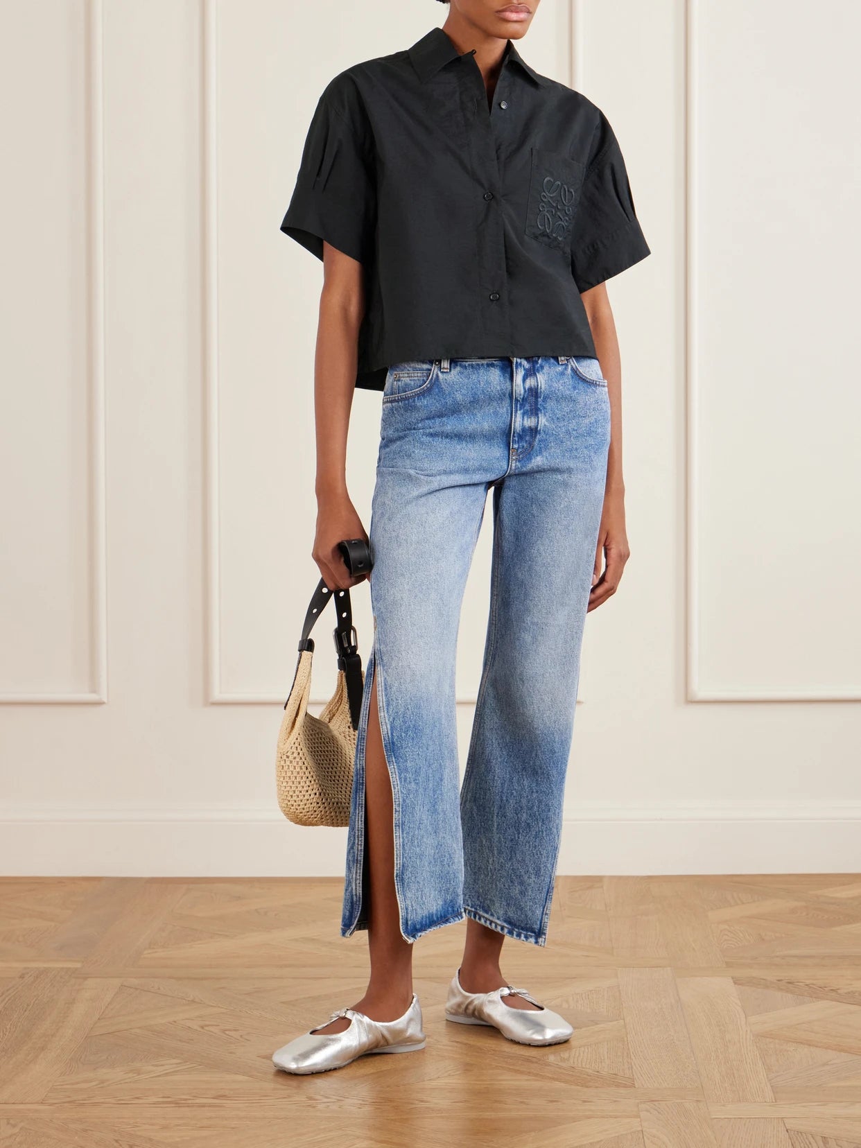 Image of a model wearing Tops. Product name - + Paula's Ibiza Anagram-embroidered Cotton-blend Shirt in Black colour by brand - LOEWE