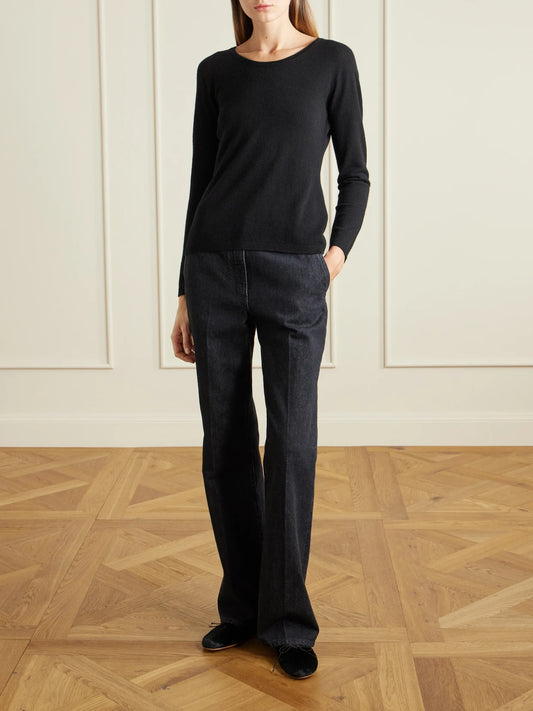 Image of a model wearing Outerwear. Product name - Nezana Cashmere Sweater in Black colour by brand - The Row