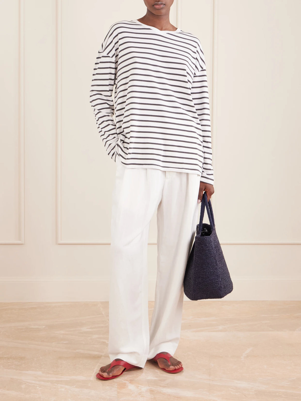 Image of a model wearing Tops. Product name - The High Striped Cotton T-shirt in Blue colour by brand - Jamie Haller