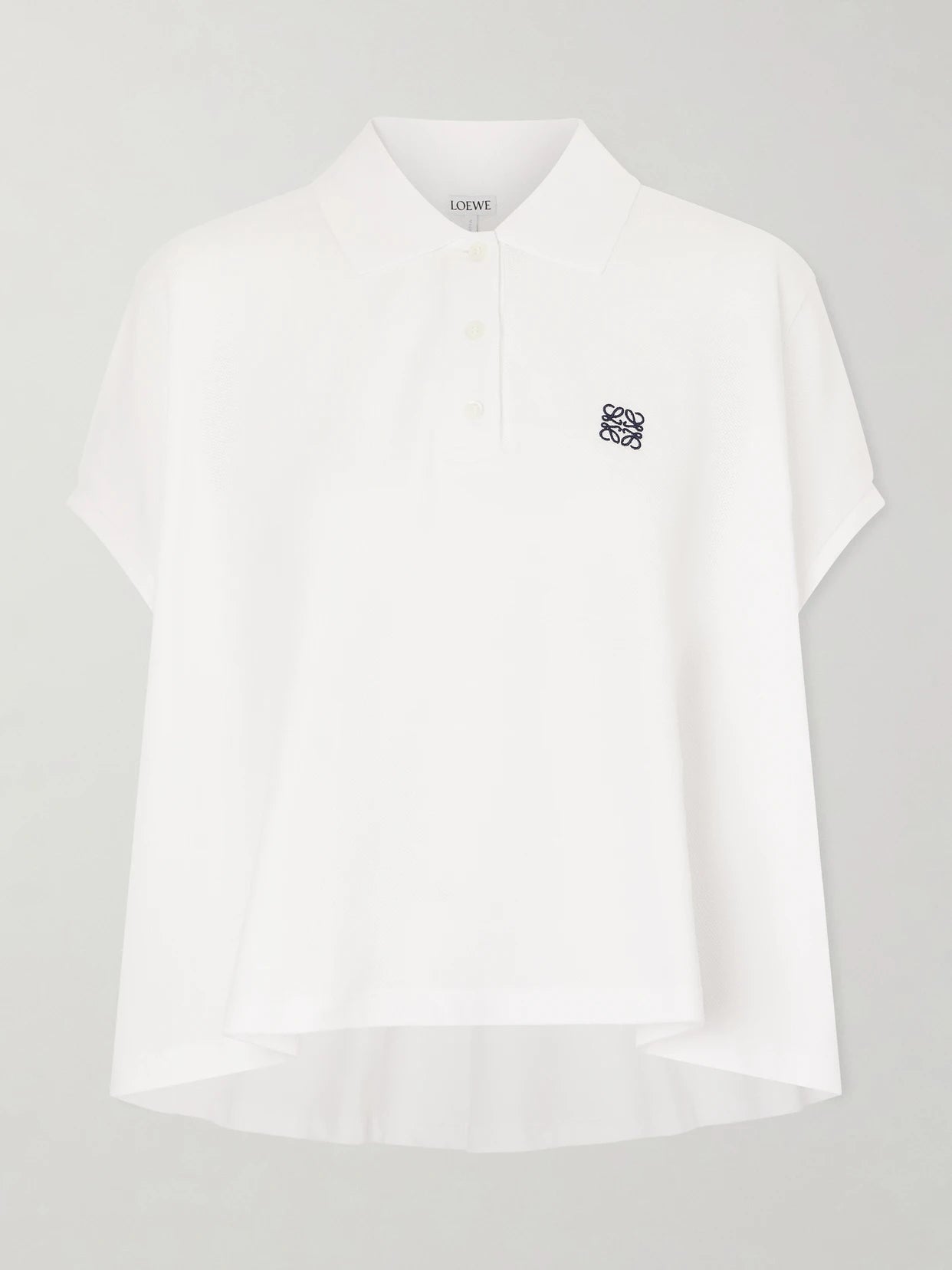 Image of a model wearing Tops. Product name - Anagram Embroidered Cotton-piqué Polo Shirt in White colour by brand - LOEWE