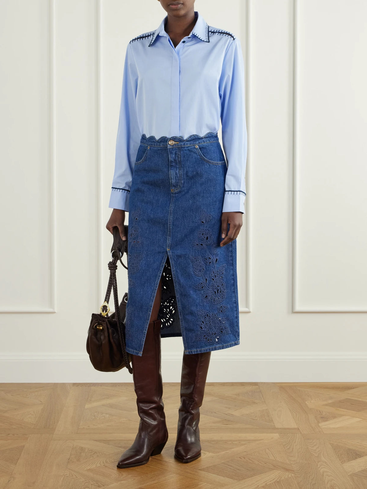 Image of a model wearing Skirts. Product name - Scalloped Richilieu Denim Midi Skirt in Dark denim colour by brand - Farm Rio