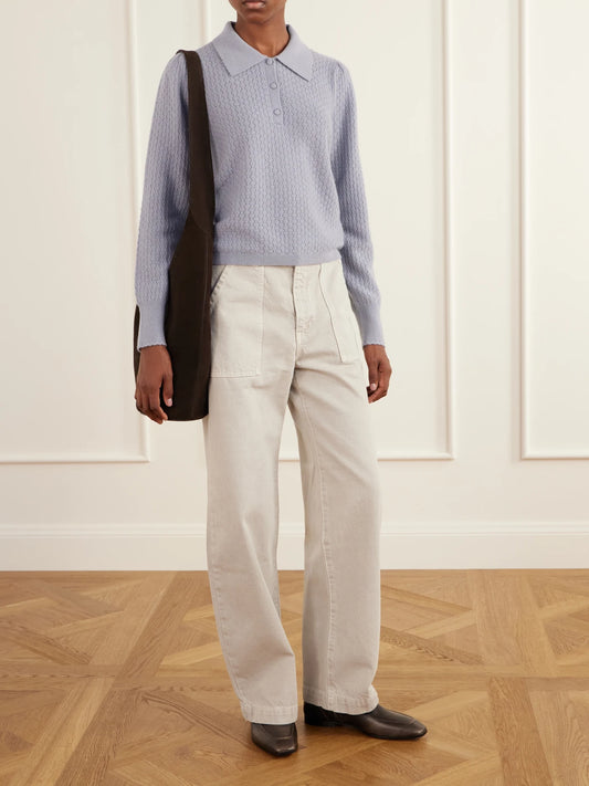 Image of a model wearing Outerwear. Product name - The Honeycomb Cashmere Polo Sweater in Light blue colour by brand - FRAME