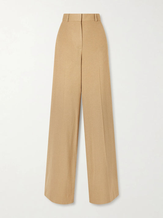 Image of a model wearing Pants. Product name - Dender Silk-twill Wide-leg Pants in Camel colour by brand - The Row