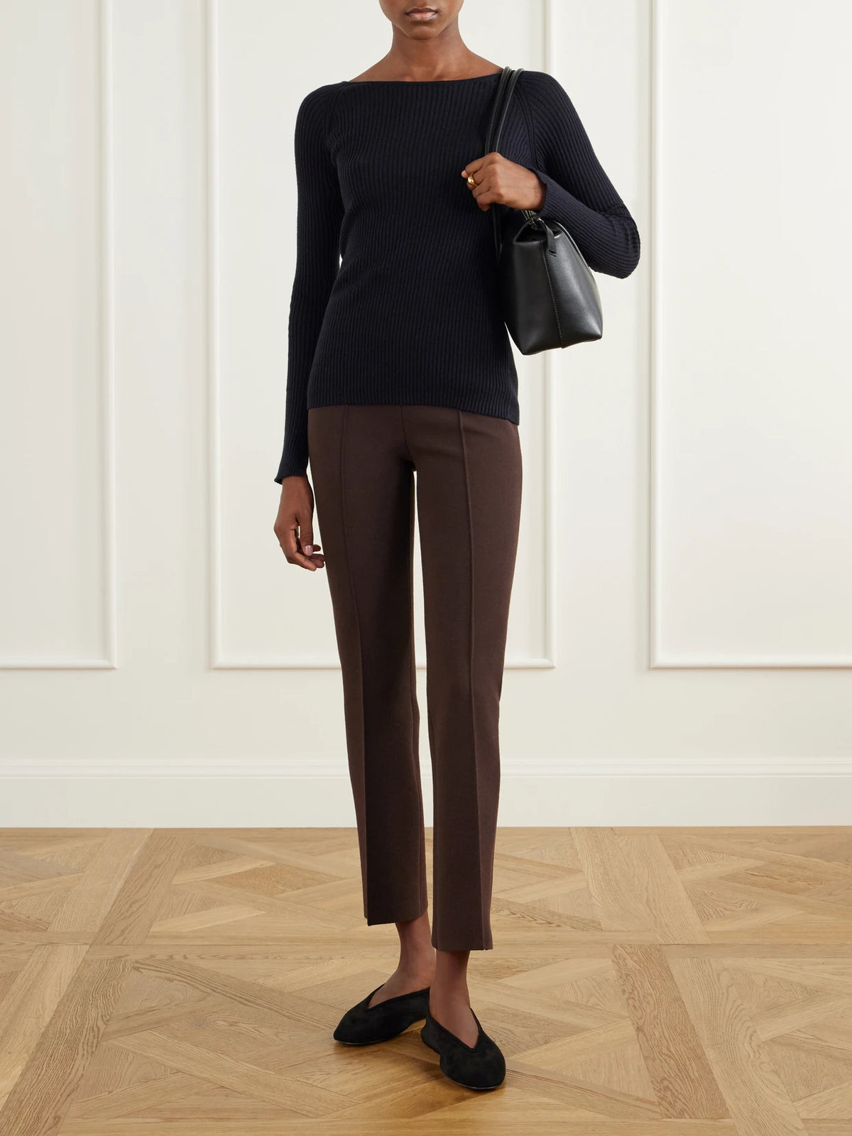 Image of a model wearing Pants. Product name - Geo Kick Cotton-blend Cropped Flared Pants in Chocolate colour by brand - HIGH SPORT