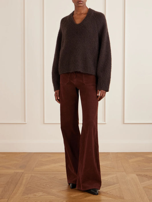 Image of a model wearing Outerwear. Product name - Isley Cashmere Sweatshirt in Dark brown colour by brand - Nili Lotan
