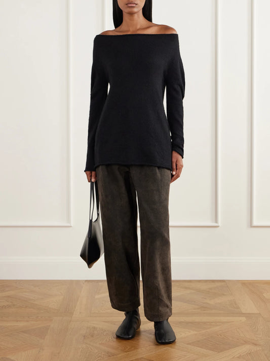 Image of a model wearing Outerwear. Product name - Off-the-shoulder Wool-blend Sweater in Black colour by brand - Lauren Manoogian