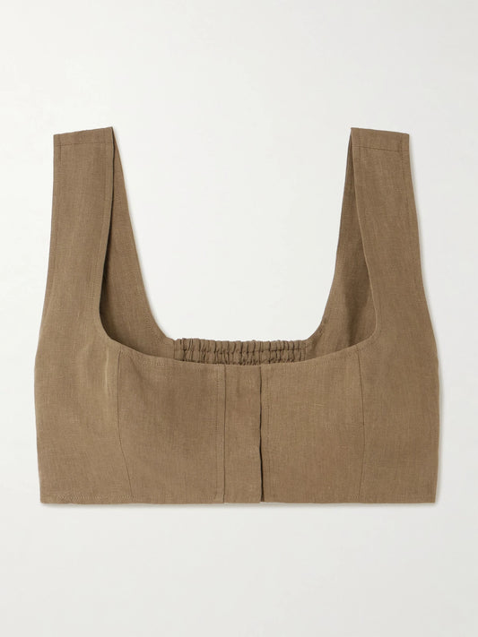Image of a model wearing Tops. Product name - Jirja Cropped Linen Top in Brown colour by brand - Le Kasha