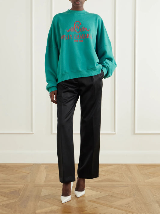 Image of a model wearing Tops. Product name - Chavantino Logo-embroidered Cotton-jersey Sweatshirt in Turquoise colour by brand - Willy Chavarria