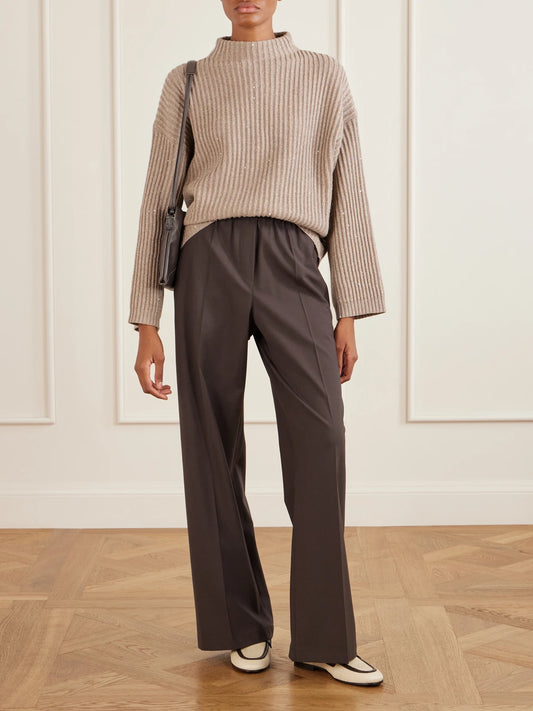 Image of a model wearing Outerwear. Product name - Sequin-trimmed Ribbed-knit Turtleneck Sweater in Beige colour by brand - Brunello Cucinelli