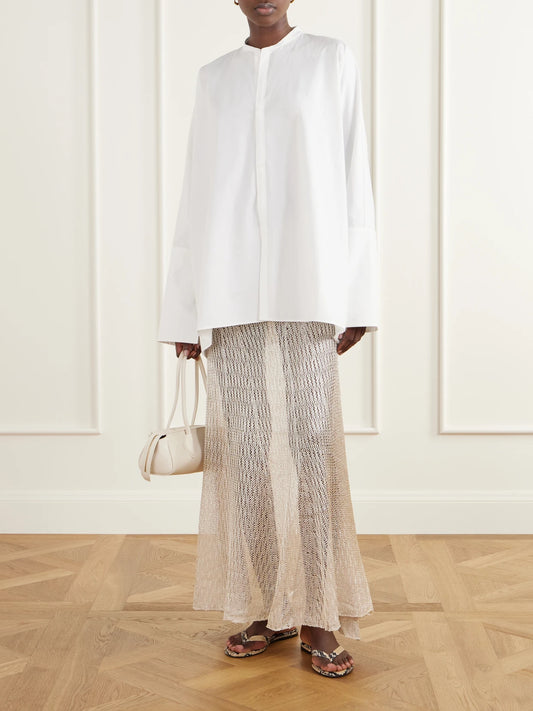 Image of a model wearing Skirts. Product name - Parasol Open-knit Maxi Skirt in Sand colour by brand - Ruohan