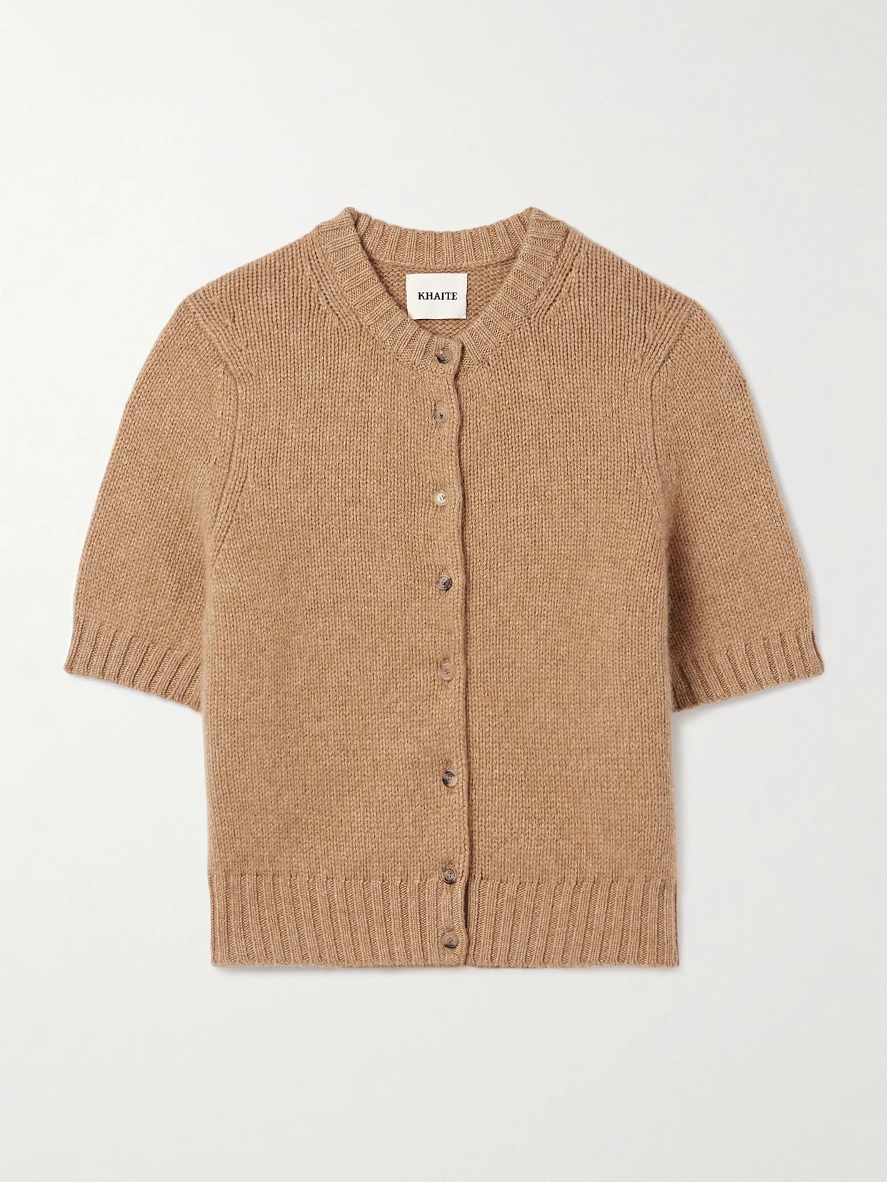 Image of a model wearing Outerwear. Product name - Nora Cropped Cashmere-blend Cardigan in Tan colour by brand - KHAITE
