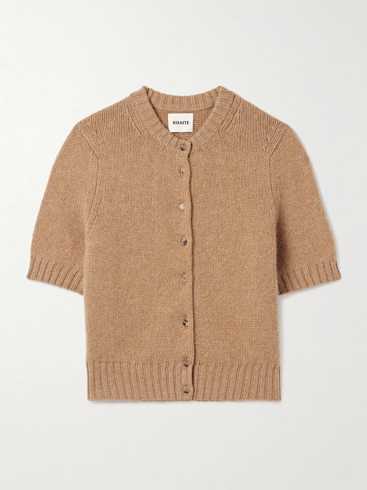Image of a model wearing Outerwear. Product name - Nora Cropped Cashmere-blend Cardigan in Tan colour by brand - KHAITE