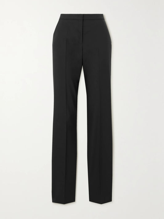 Image of a model wearing Pants. Product name - + Net Sustain Pleated Merino Wool Straight-leg Pants in Black colour by brand - Another Tomorrow