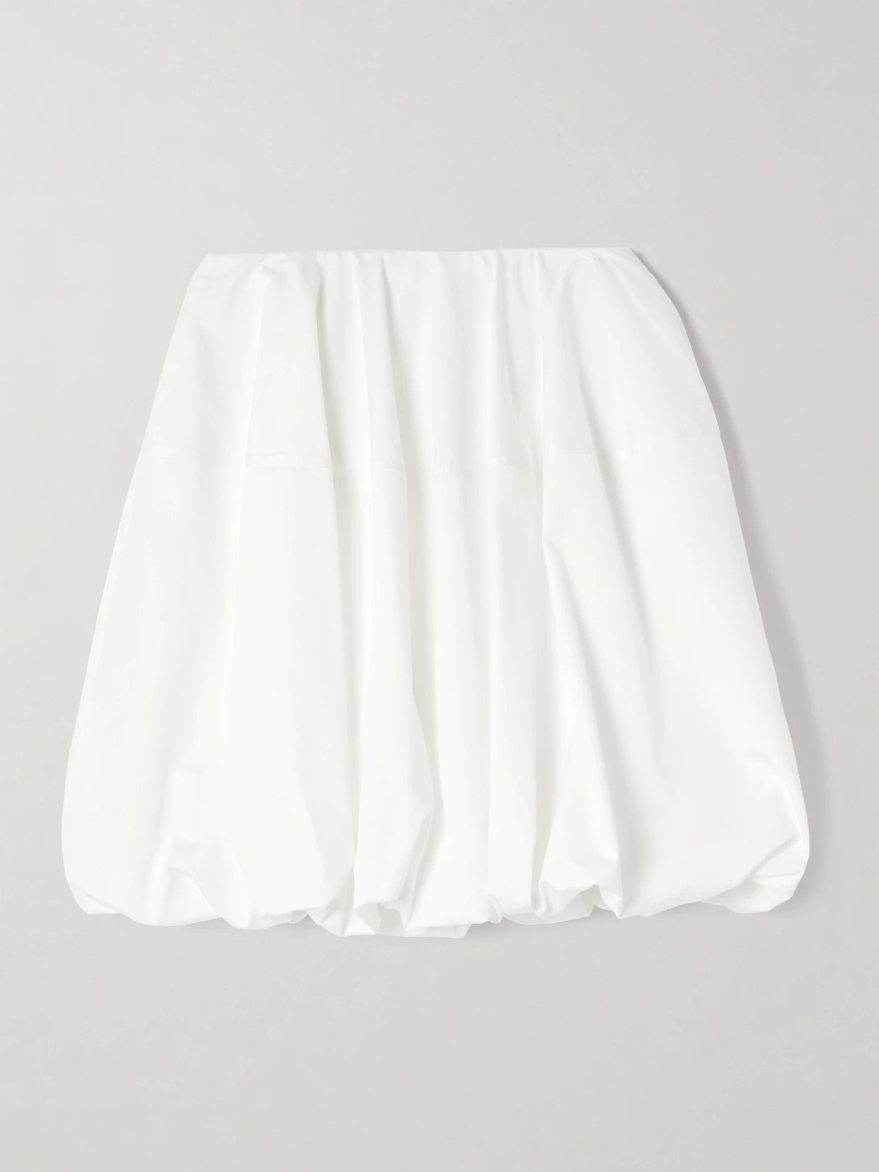 Image of a model wearing Skirts. Product name - Gathered Cotton-poplin Mini Skirt in White colour by brand - Alaïa