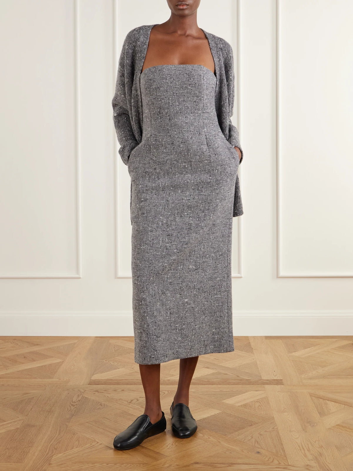 Image of a model wearing Outerwear. Product name - Wool Cardigan in Charcoal colour by brand - Auralee