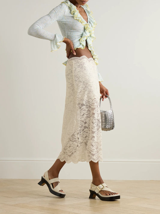 Image of a model wearing Skirts. Product name - Scalloped Lace Midi Skirt in White colour by brand - RABANNE