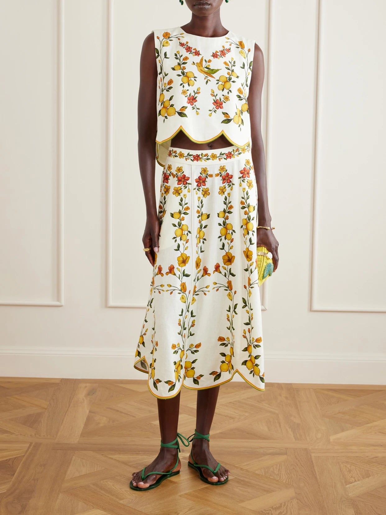 Image of a model wearing Skirts. Product name - Lemon Bouquet Printed Linen-blend Midi Skirt in Off-white colour by brand - Farm Rio