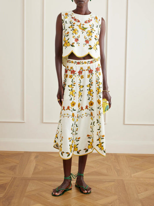 Image of a model wearing Skirts. Product name - Lemon Bouquet Printed Linen-blend Midi Skirt in Off-white colour by brand - Farm Rio